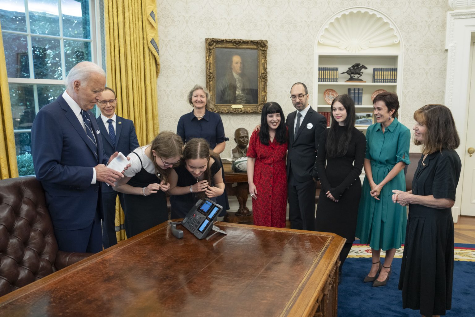President Joe Biden calls Wall Street Journal reporter Evan Gershkovich, former U.S. Marine Paul Whelan and journalist Alsu Kurmasheva after they board a plane for the trip home after being released in a prisoner swap with Russia, Thursday, August 1, 2024, in the Oval Office. (Official White House Photo by Adam Schultz)