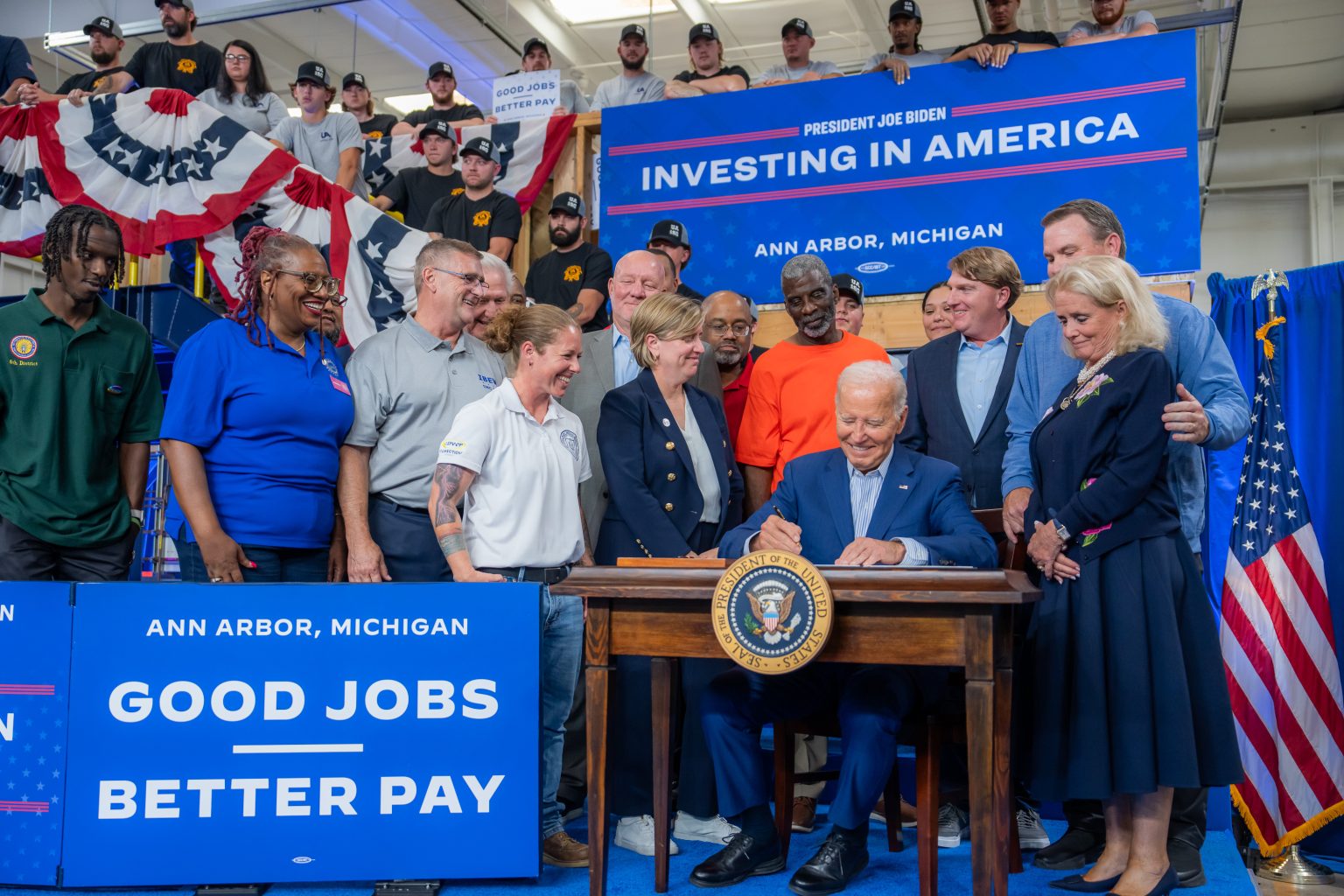 President Joe Biden, flanked by union members and labor leaders, signs an Executive Order to promote good jobs through his Investing in America agenda, Friday, September 6, 2024, at the UA Local 190 Training Center in Ann Arbor, Michigan. (Official White House Photo by Adam Schultz)